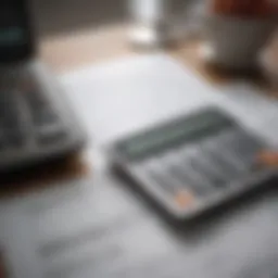 Close-up of a financial calculator and savings documents